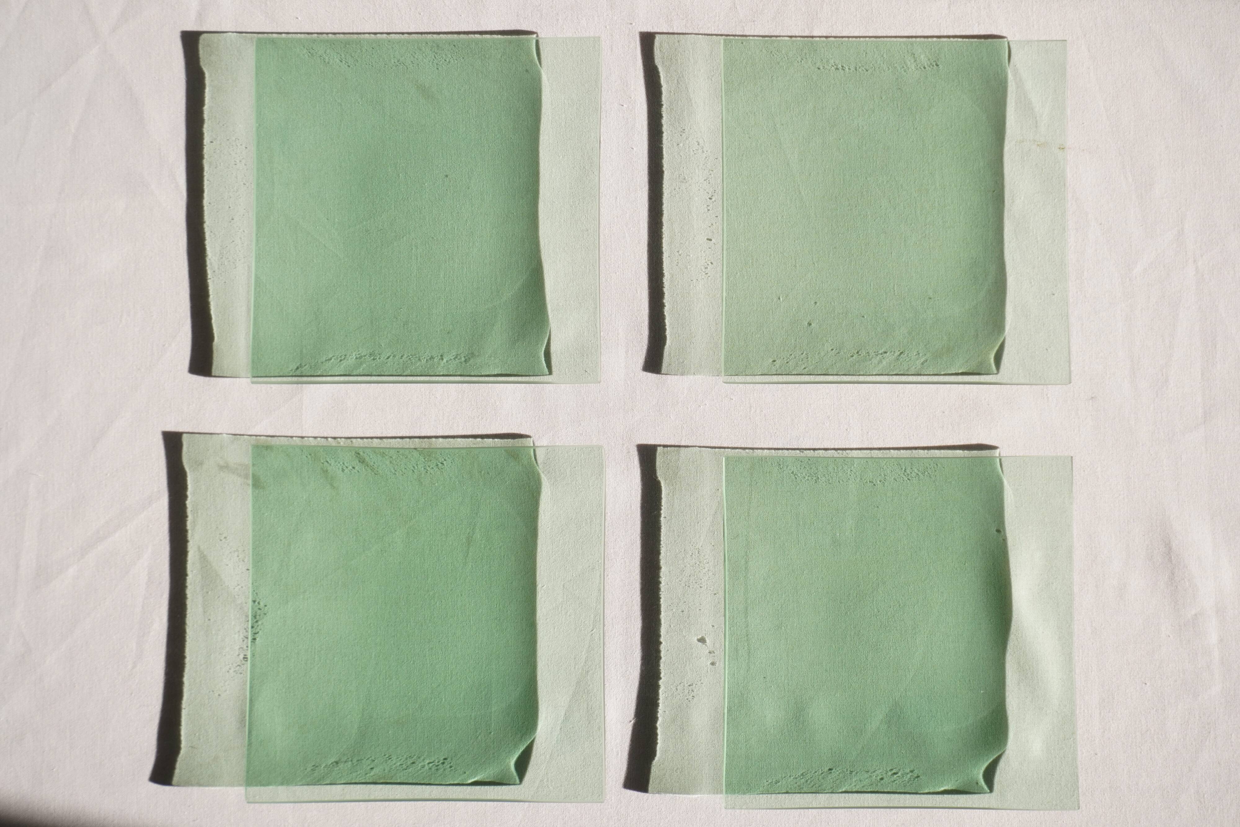 Set of 4 small square green glass plates/bowls