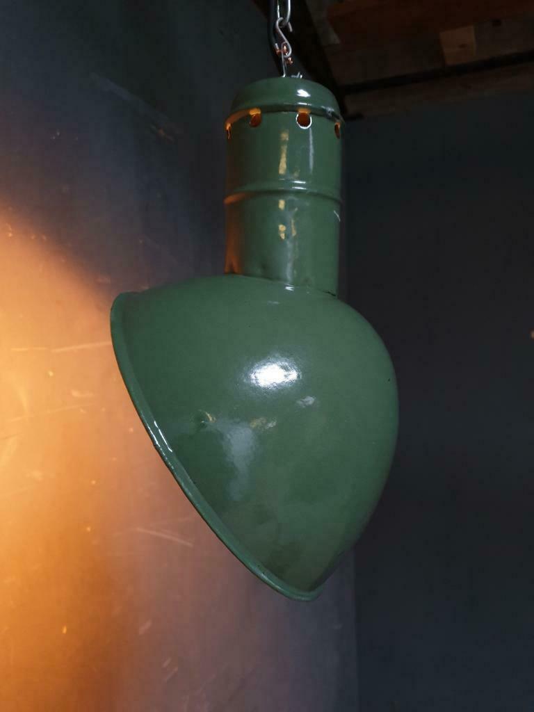 Old industrial enamel lamp in green