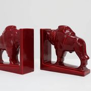Pair of red glazed ceramic Bison ox bookends in Art Deco style, Belgium