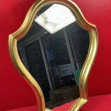 Mirror with a wavy shape, wood and gilded stucco