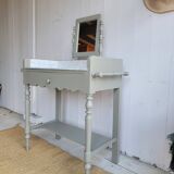 Antique wooden dressing table with marble top and mirror.