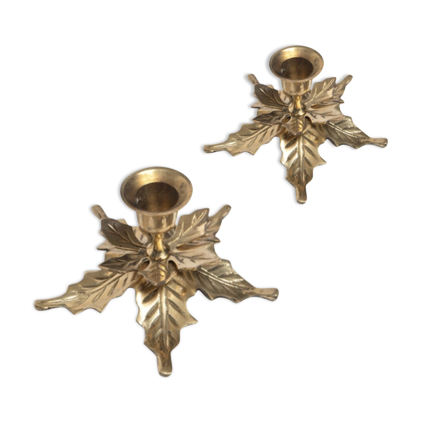 Two candlesticks in holly leaves