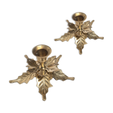 Two candlesticks in holly leaves