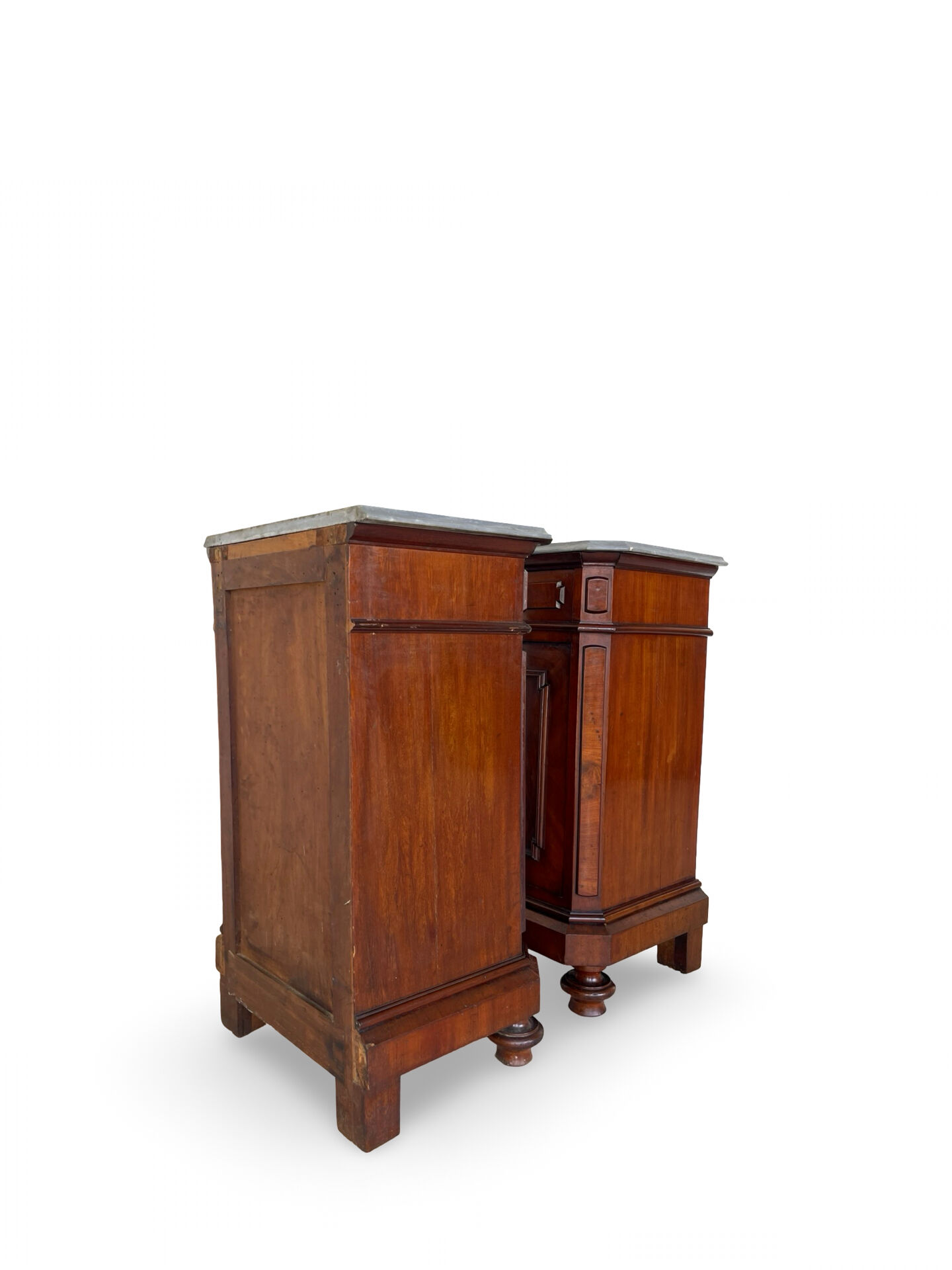 A pair of antique walnut bedside tables from the 1890s.