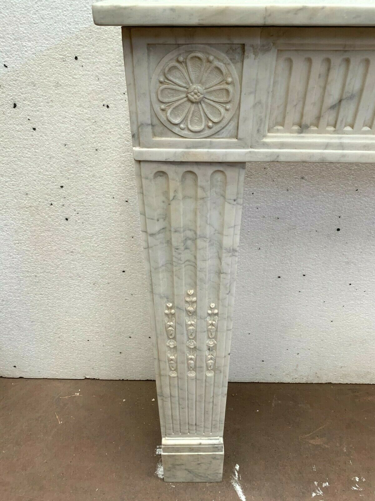 Louis XVI fireplace in 19th century white Carrara marble