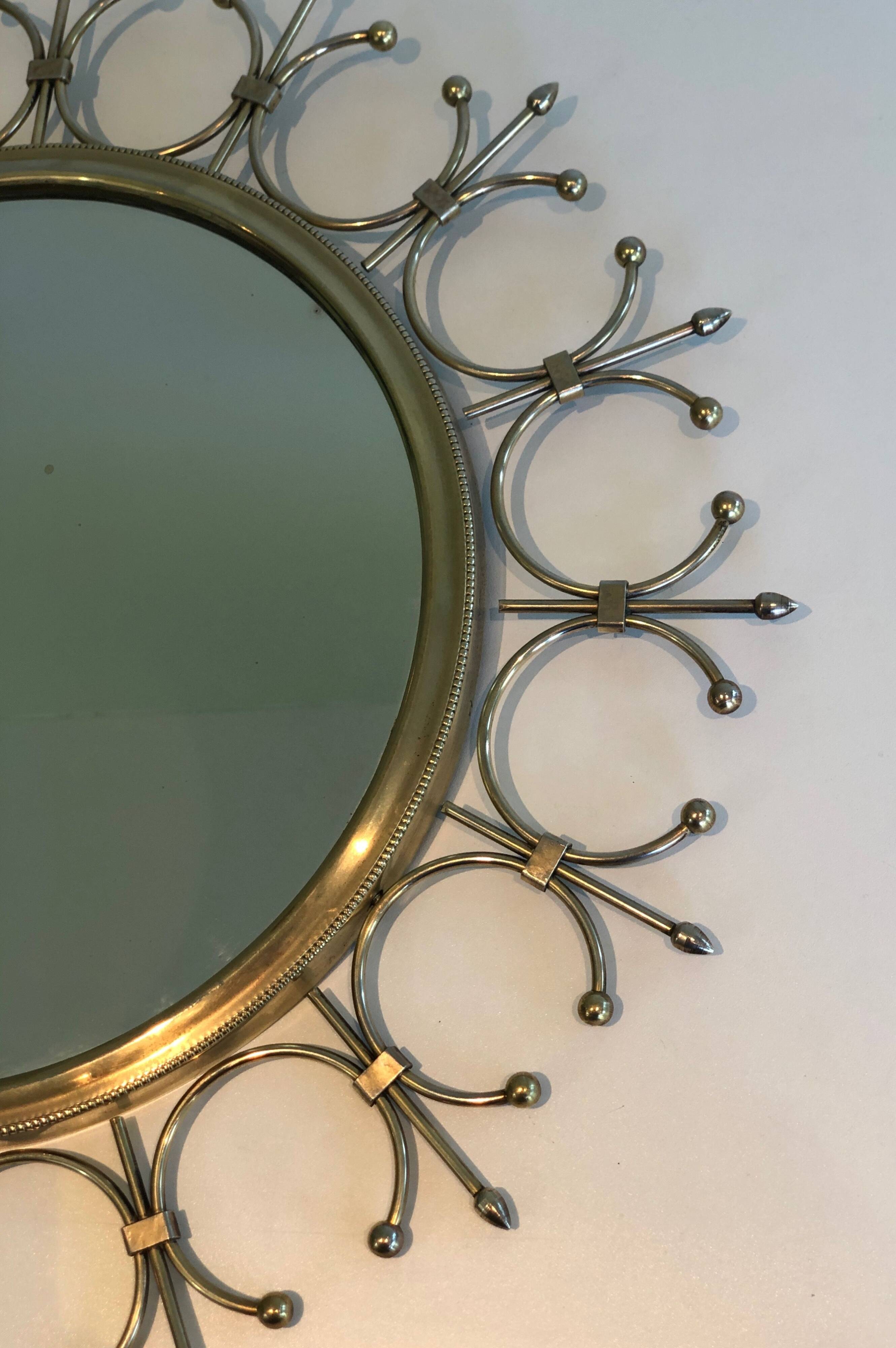 Sun mirror in brass and brushed steel