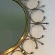 Sun mirror in brass and brushed steel