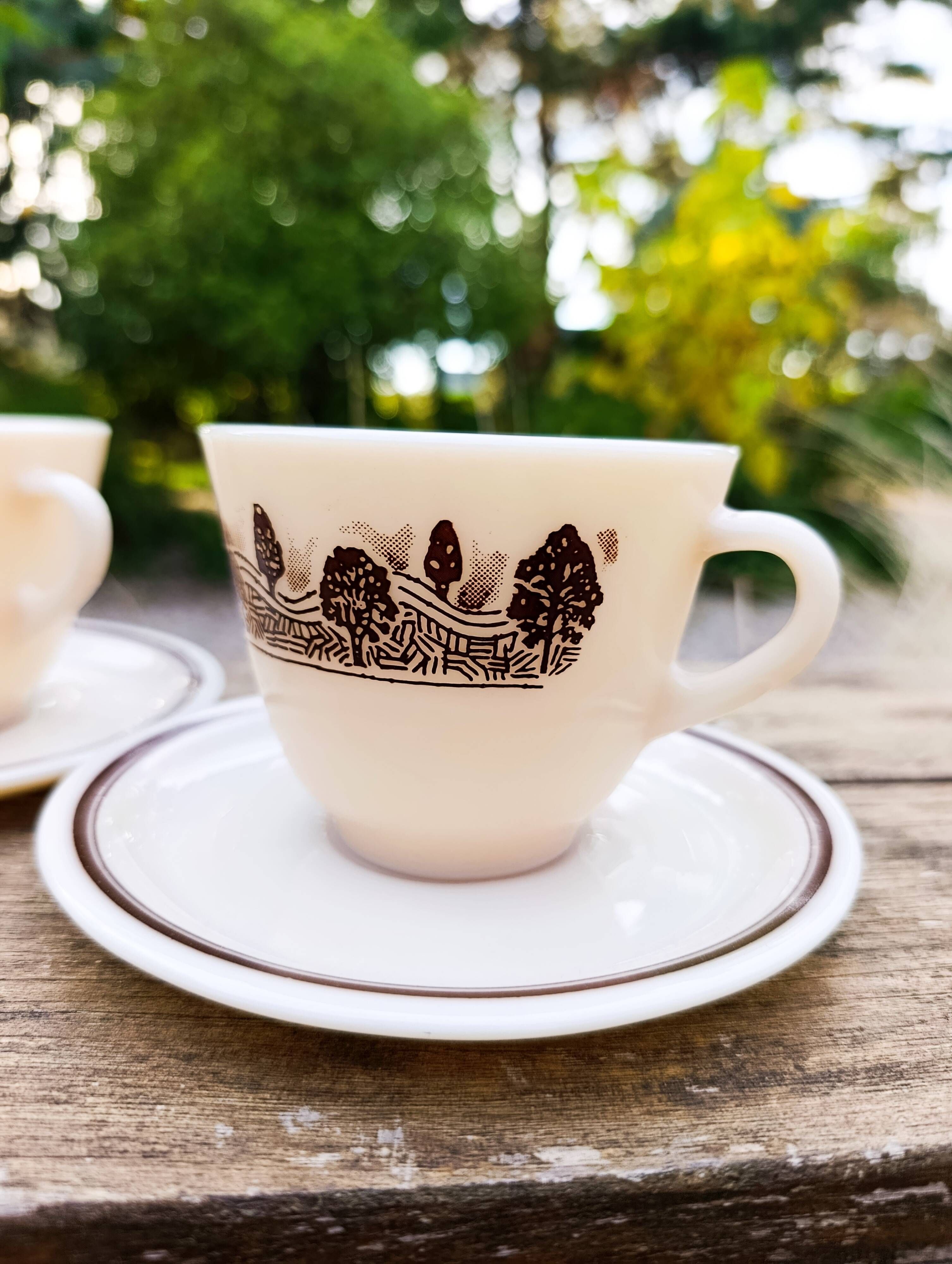 Two vintage opaline glass cups/saucers JAJ Pyrex England.