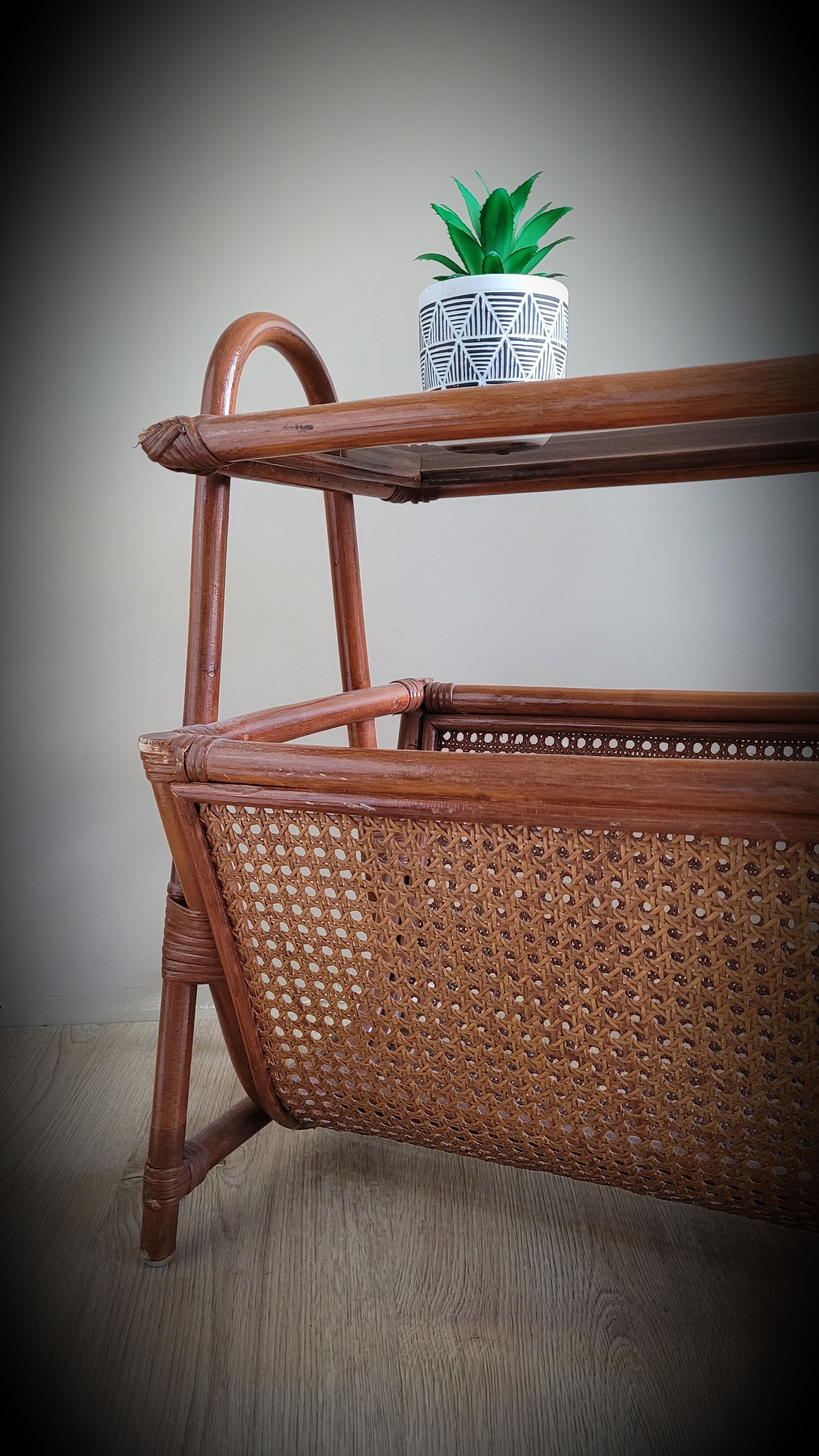 Braided rattan side table and smoked glass