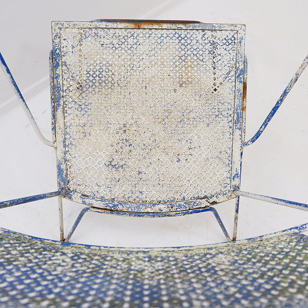 Vintage perforated metal armchair from the 1950s.