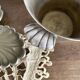 Antique champagne bucket with shell handles.