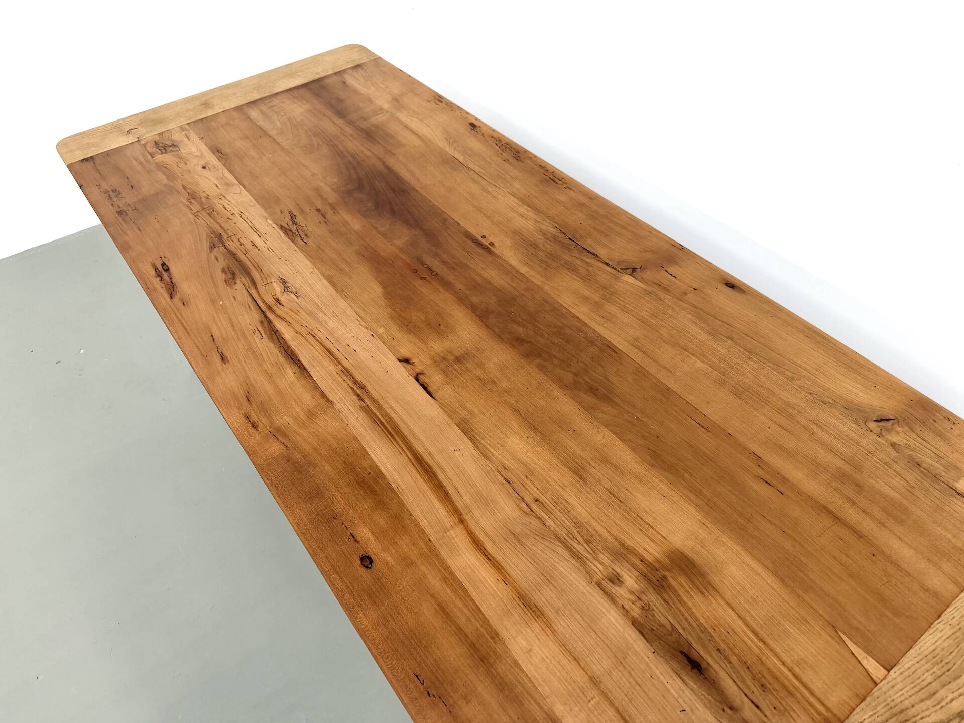 Farm table in solid cherry — Saber legs, Circa 1880