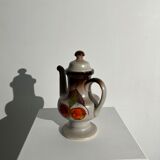 Vintage stoneware teapot with flower and fruit patterns
