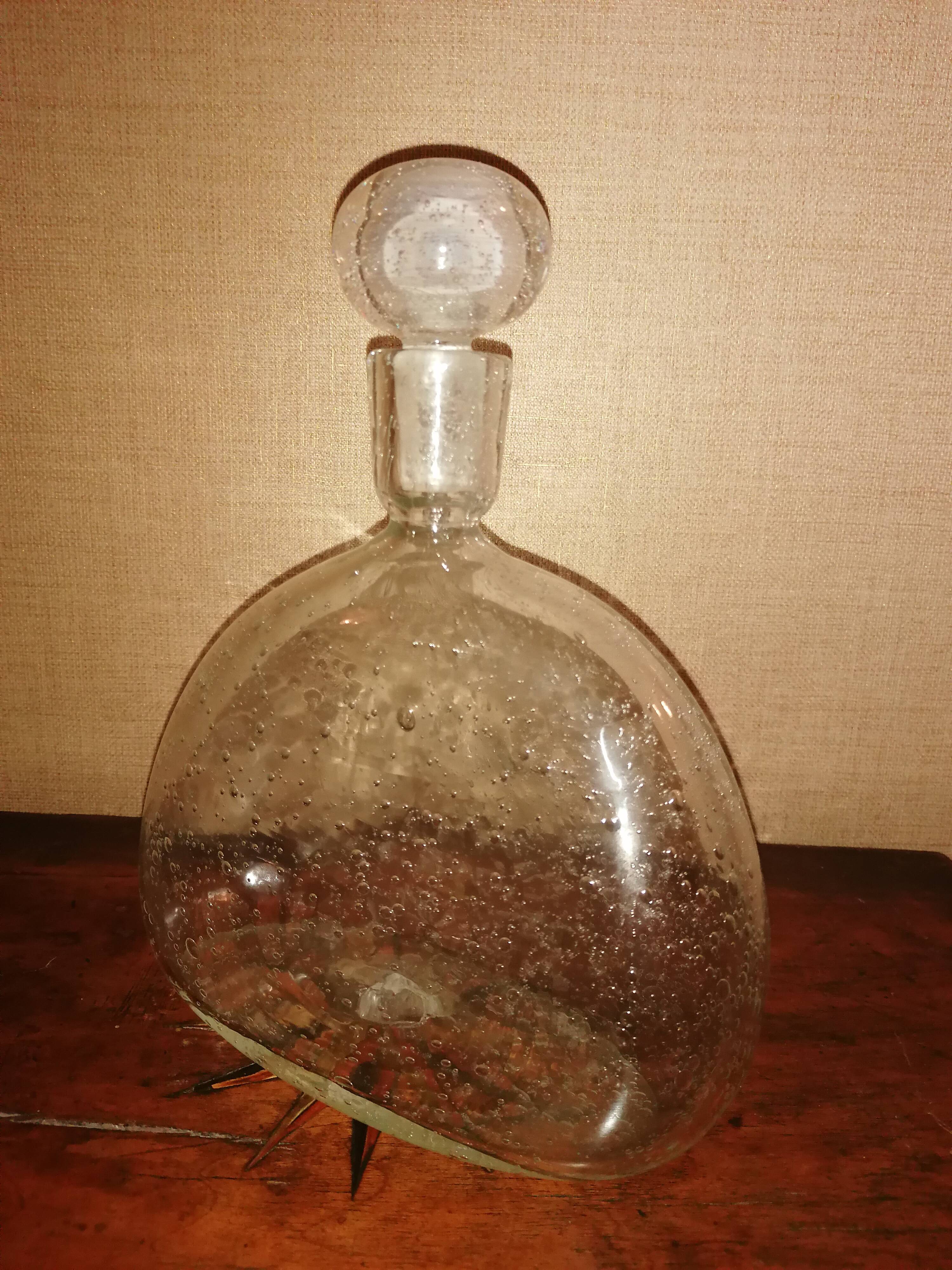 Clear bubble glass bottle molded for easy manual gripping