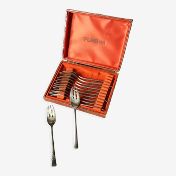Box of silver metal cake forks