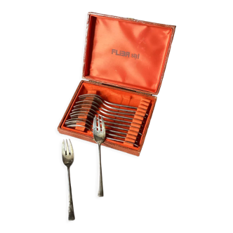 Box of silver metal cake forks