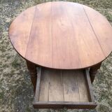 Louis Philippe oval shuttered table in solid cherry wood with 2 drawers.