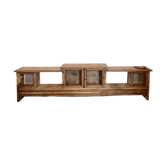 Old wooden TV cabinet with raw wood and mesh doors.