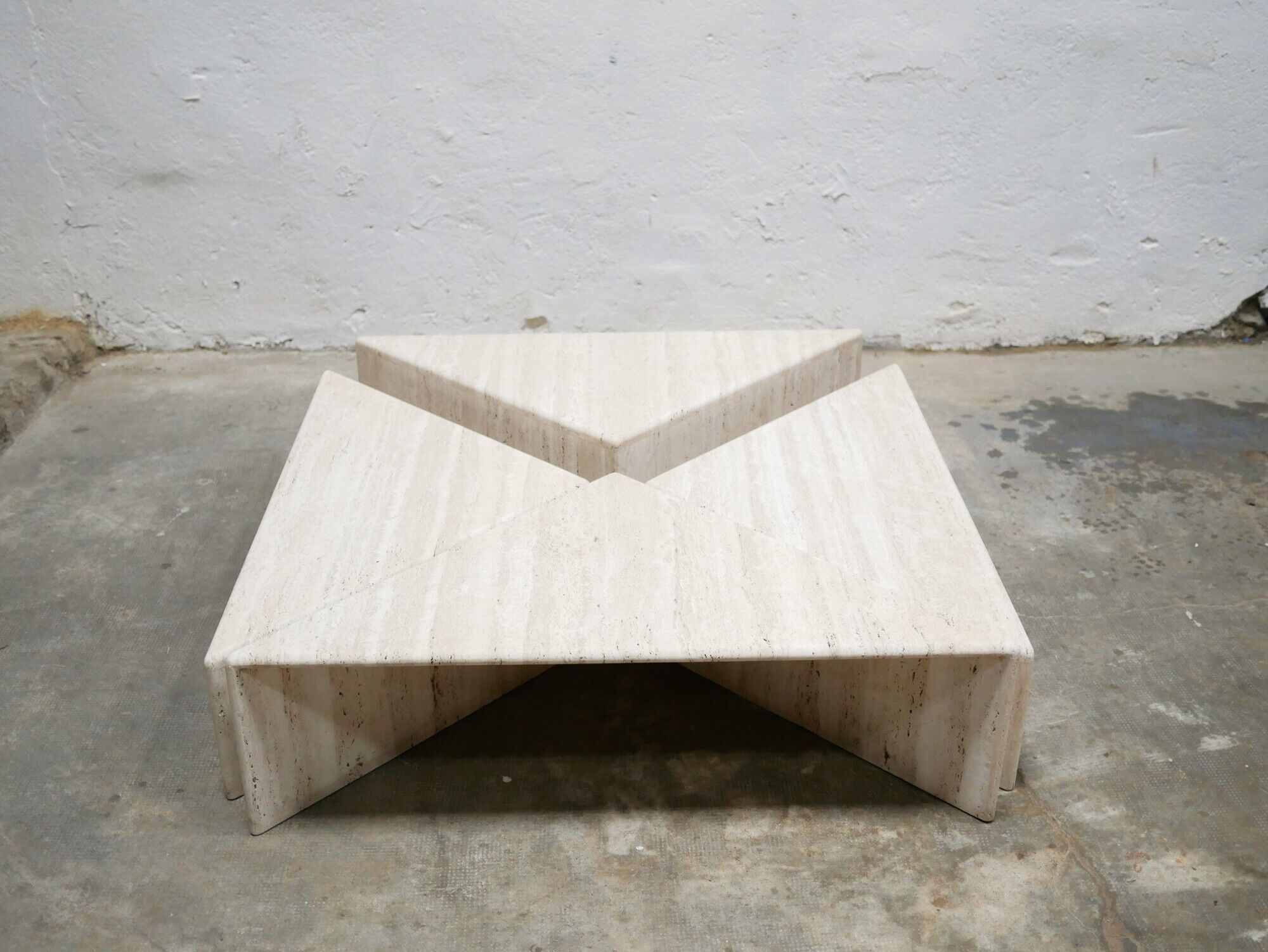 Series of 2 vintage travertine coffee tables published by Roche Bobois