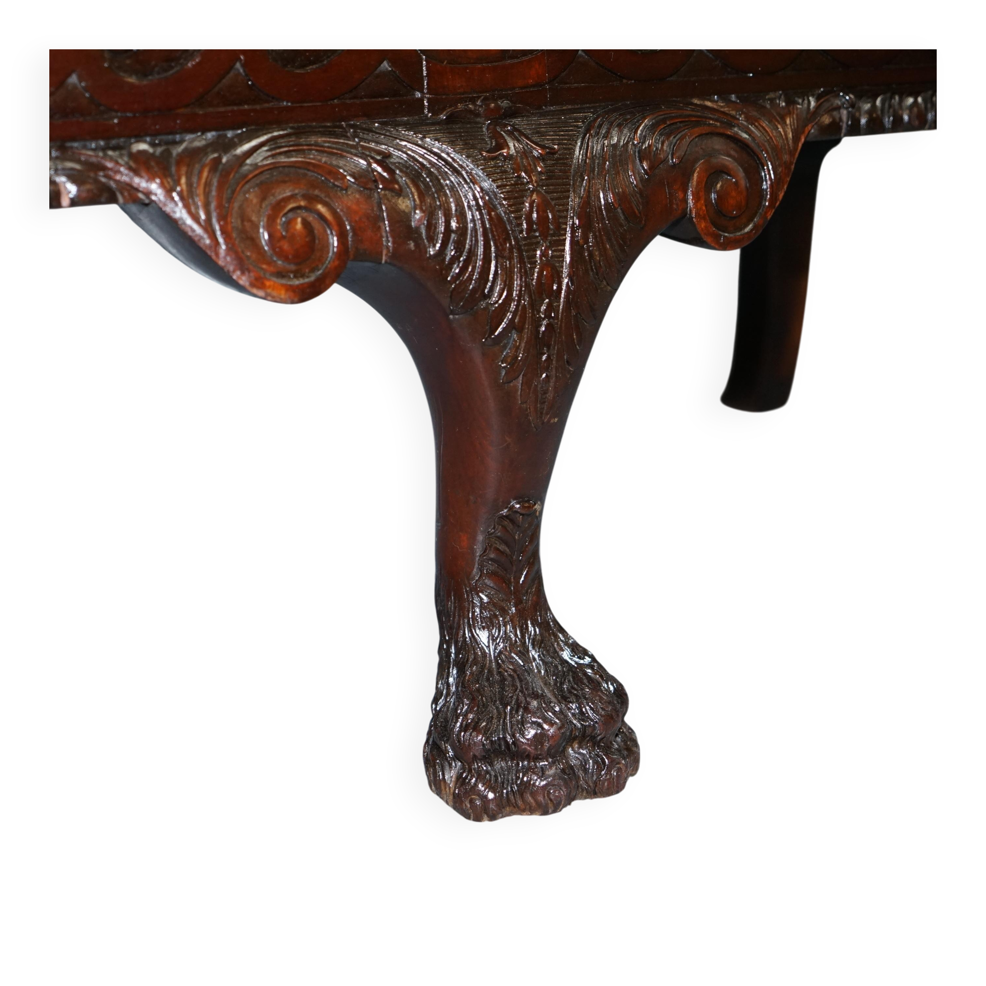Chesterfield leather canapé in Georgian style with lion paw carved feet.