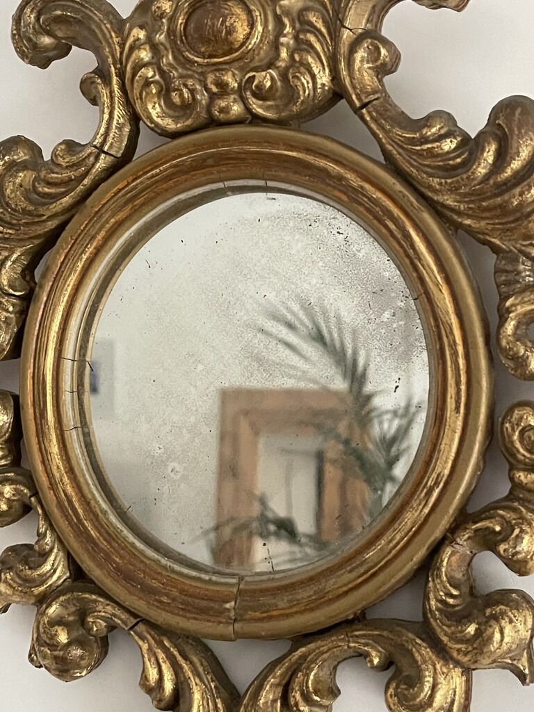Old mirror in gilded wood