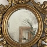 Old mirror in gilded wood