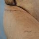 Vintage sheepskin armchair with a beautiful light colour and elegant legs