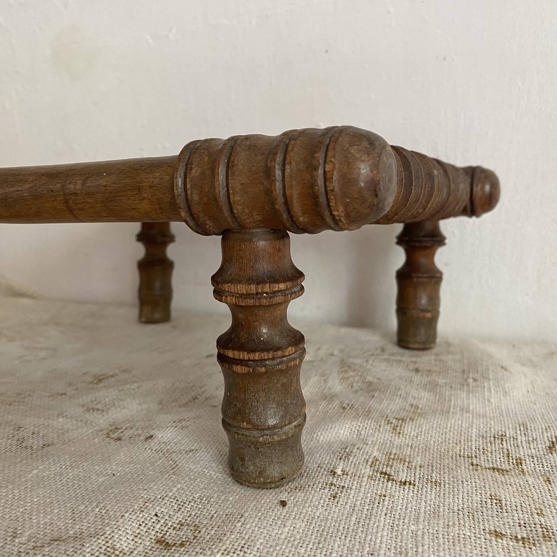 Old low turned wooden stool