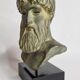 Bust of Poseidon in patinated plaster on wooden base