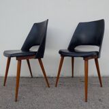 2 chaises en skaï noir pieds compas Louis Paolozzi