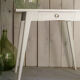 White compass feet table