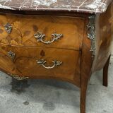 Curved and inlaid Louis XV style chest of drawers