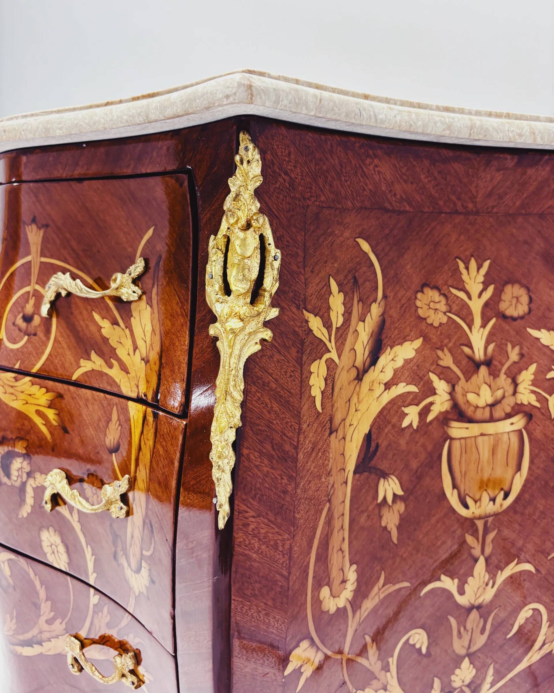 Marquetry chest of drawers with marble top in Louis XV style
