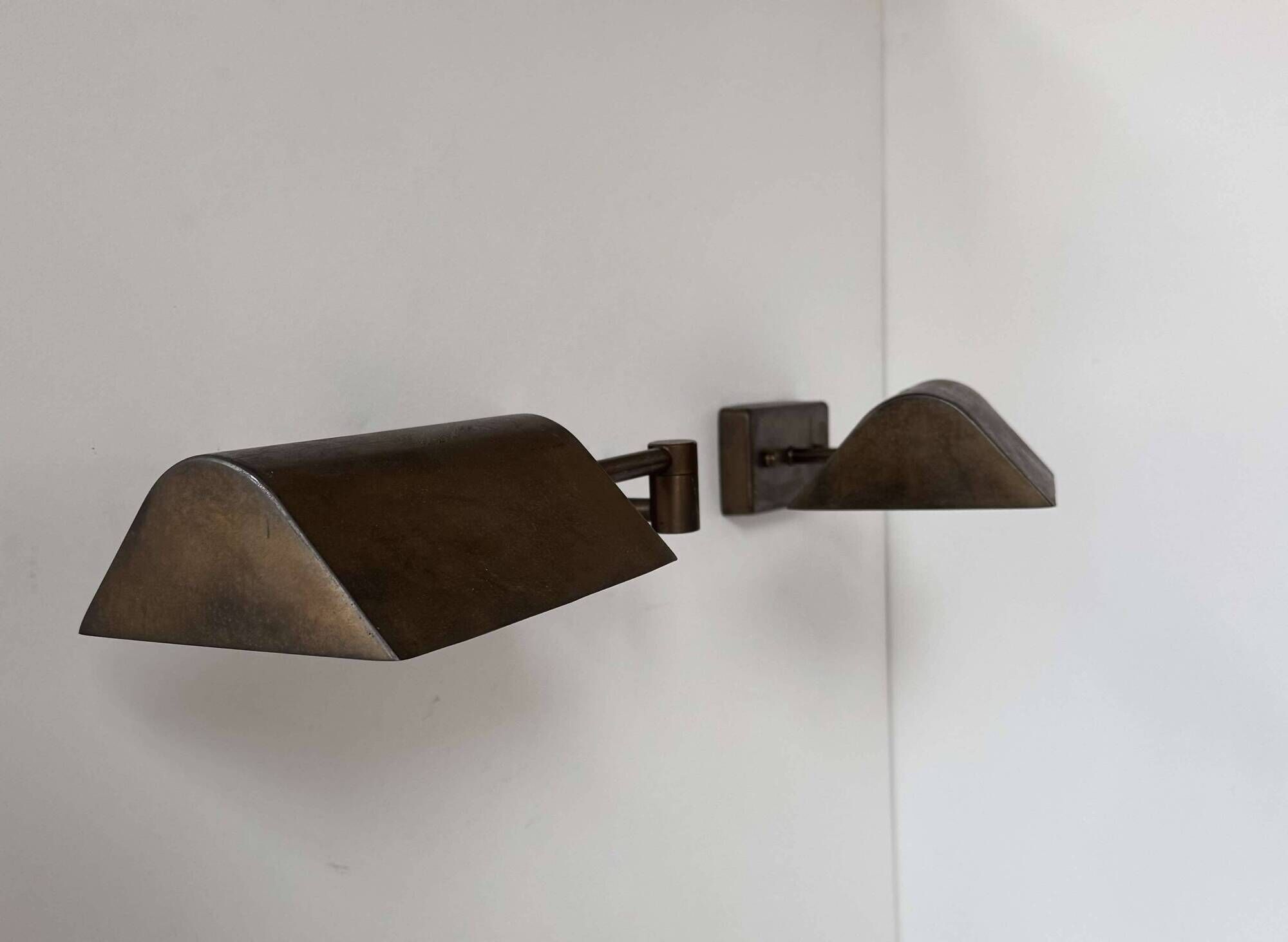 Pair of vintage adjustable wall lights, patinated brass, France 1970.