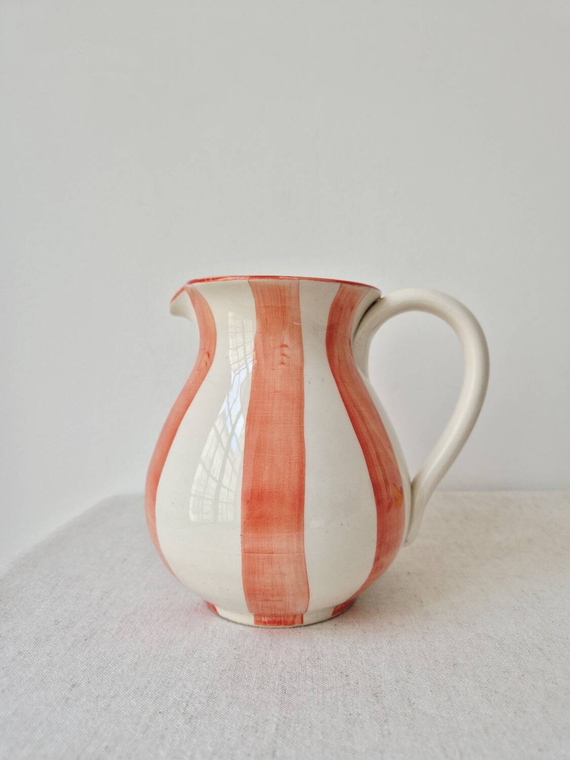 Vintage ceramic vase/pitcher with handmade mandarin stripes.