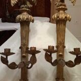 Pair of candle holders in wall, eagle pattern in gilded wood and brass