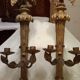 Pair of candle holders in wall, eagle pattern in gilded wood and brass