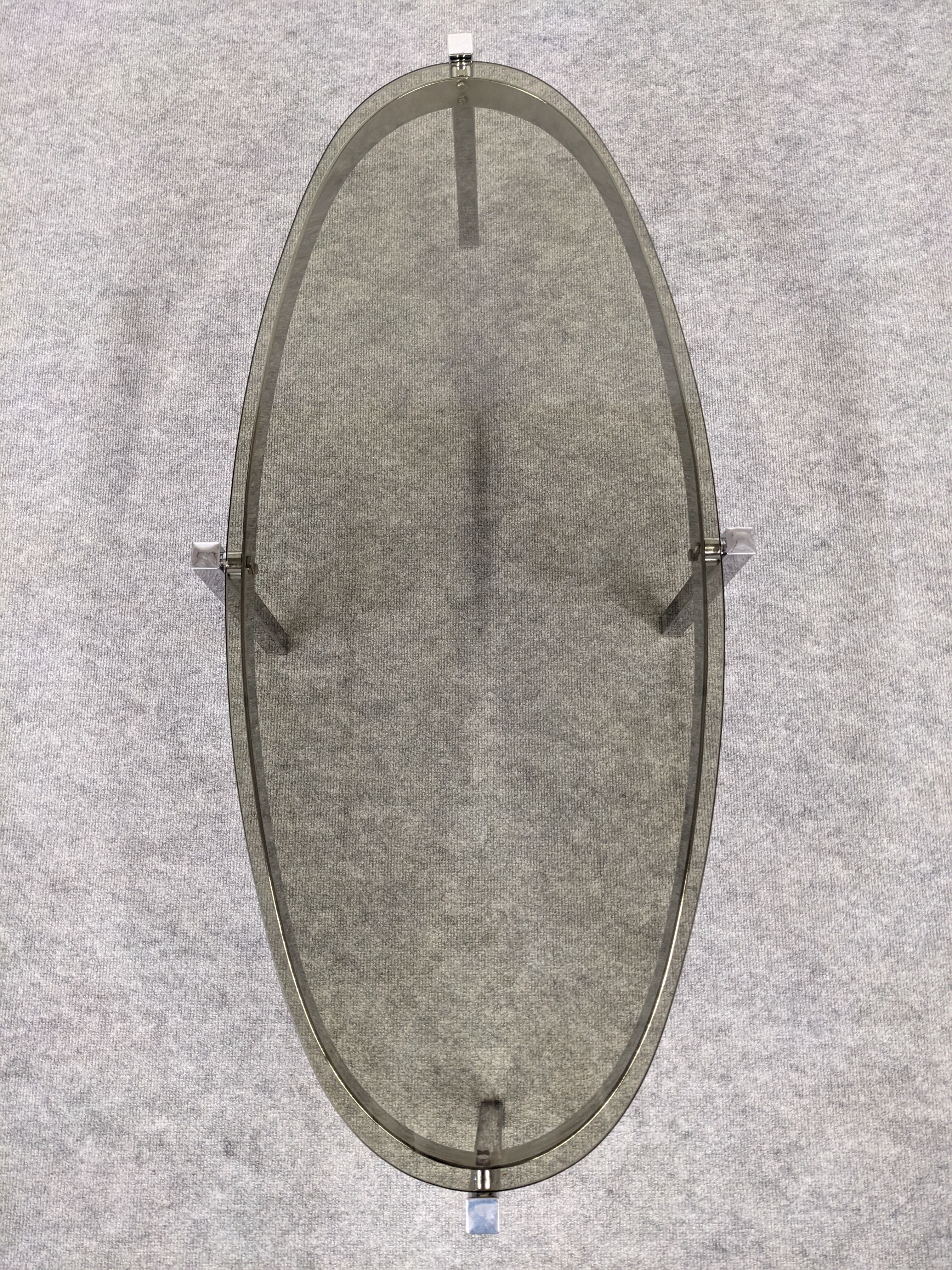 Oval smoked glass coffee table from the 60s/70s