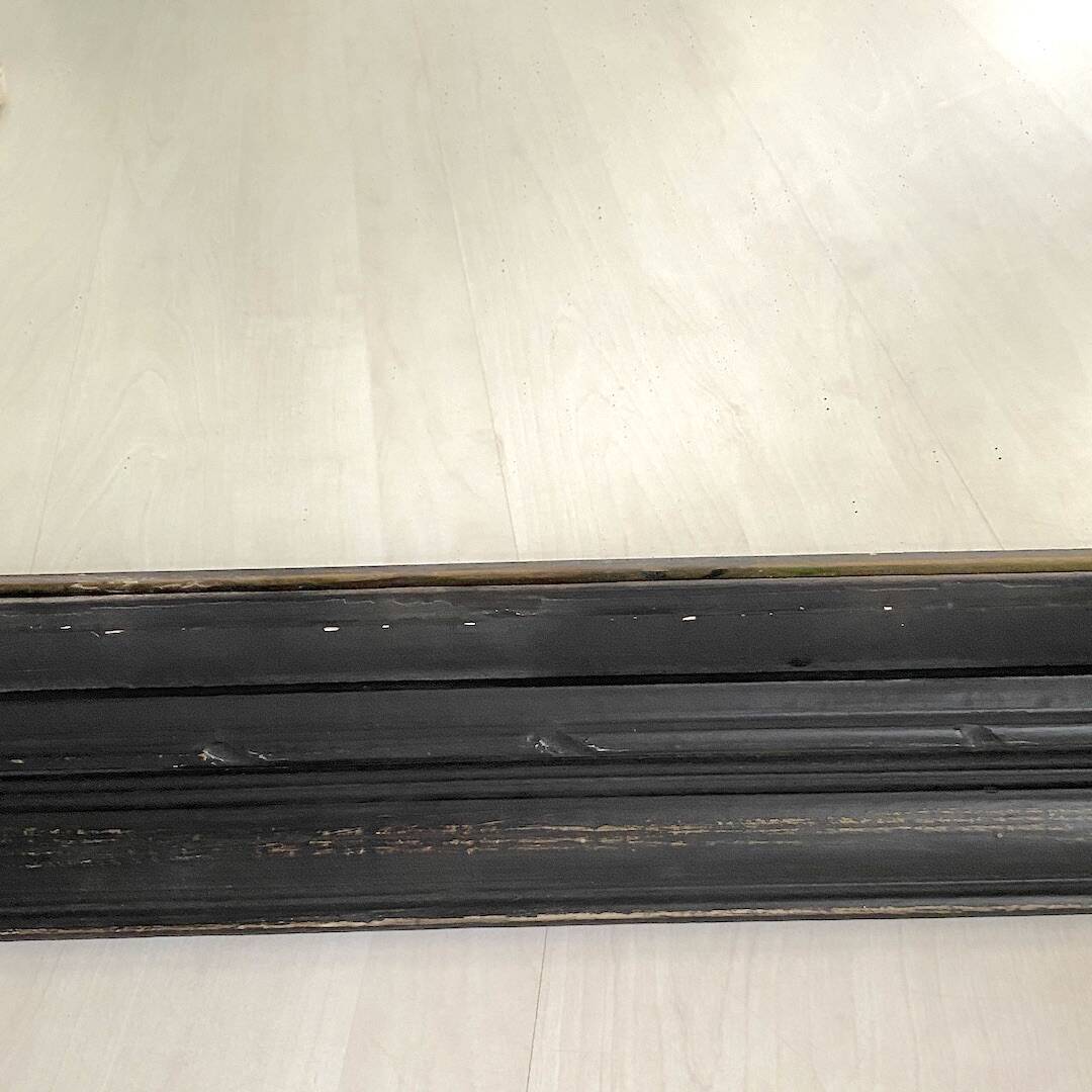 1950s mirror, matte black wood with a patina.