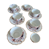5 tea cups with saucers and 2 small pots, made in England.