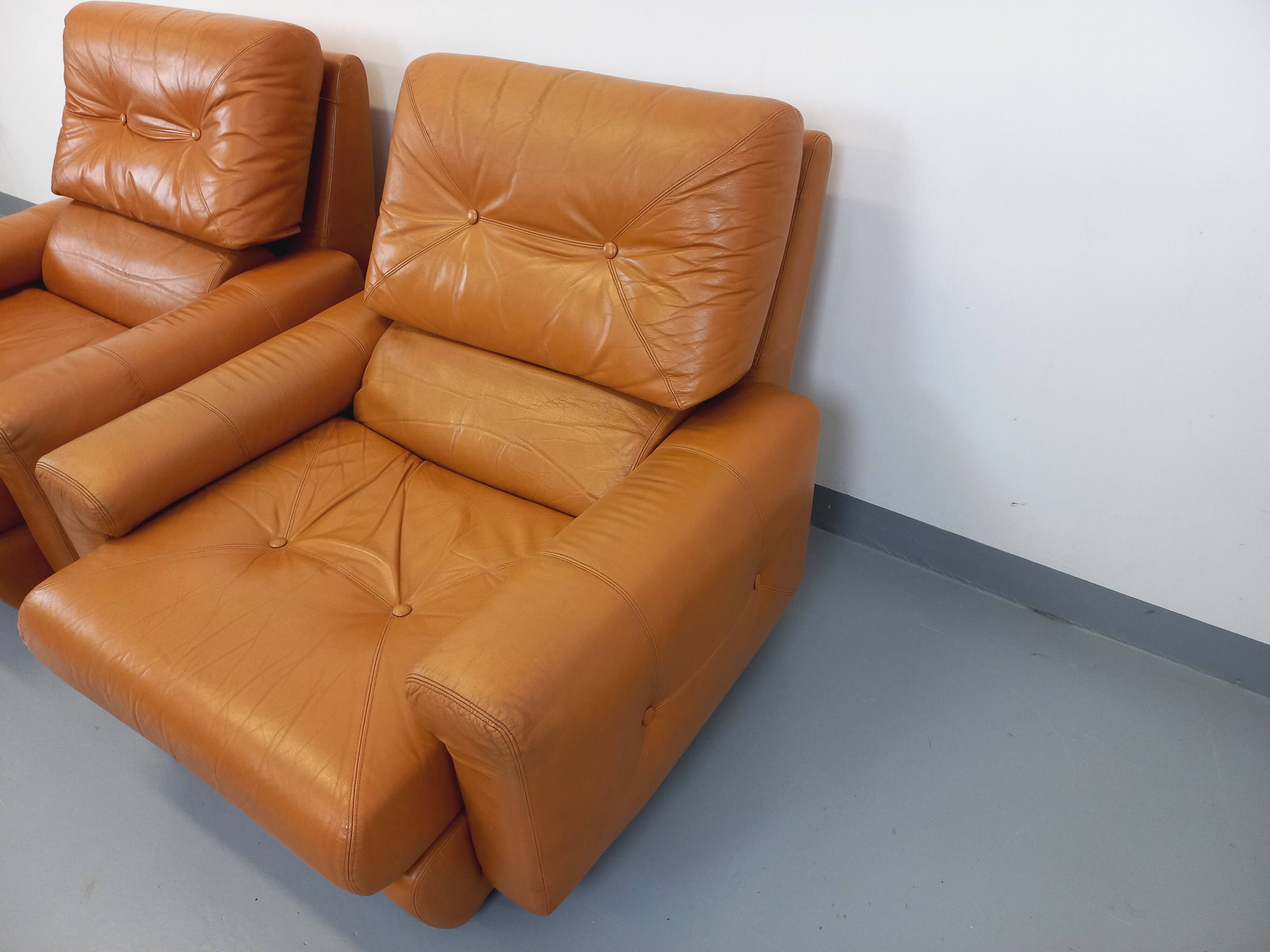 Pair of vintage leather lounge chairs from the 60s and 70s