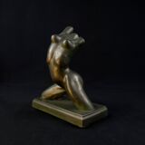 Modern sculpture of a nude woman in green ceramic, signed Carlos Nazareth