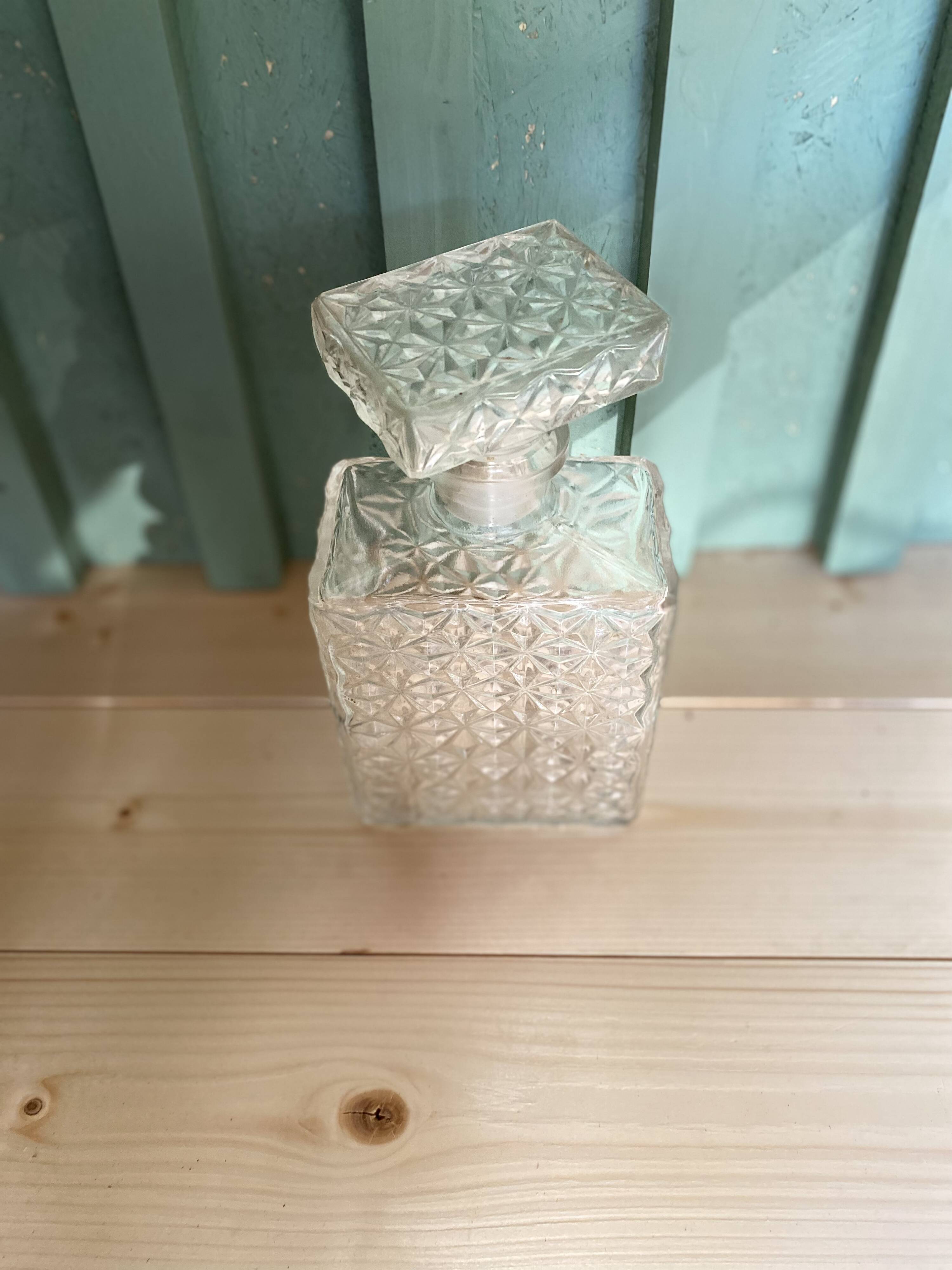 Old molded glass whiskey bottle