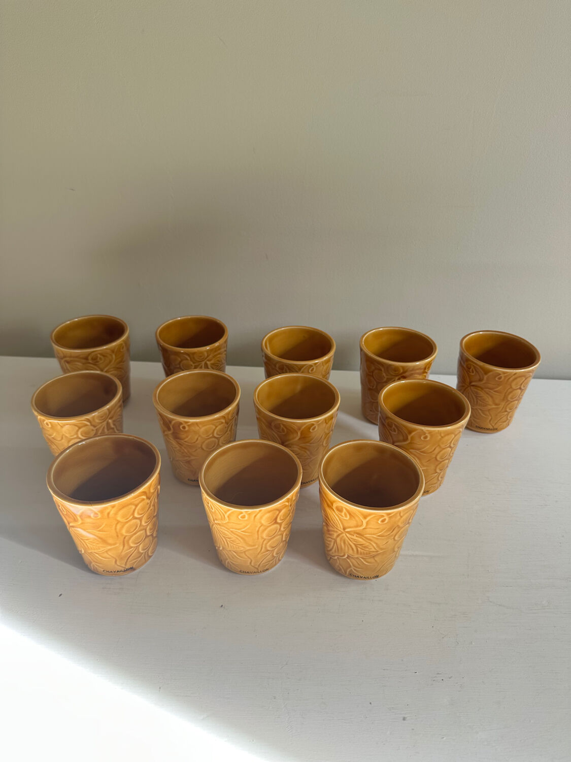 Set of 12 ochre Chavaillon de Sarreguemines cups