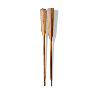 Duo of old wooden oars