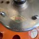 Orange tractor stool, pivoting adjustable mower, Fermigier Mirima 70.
