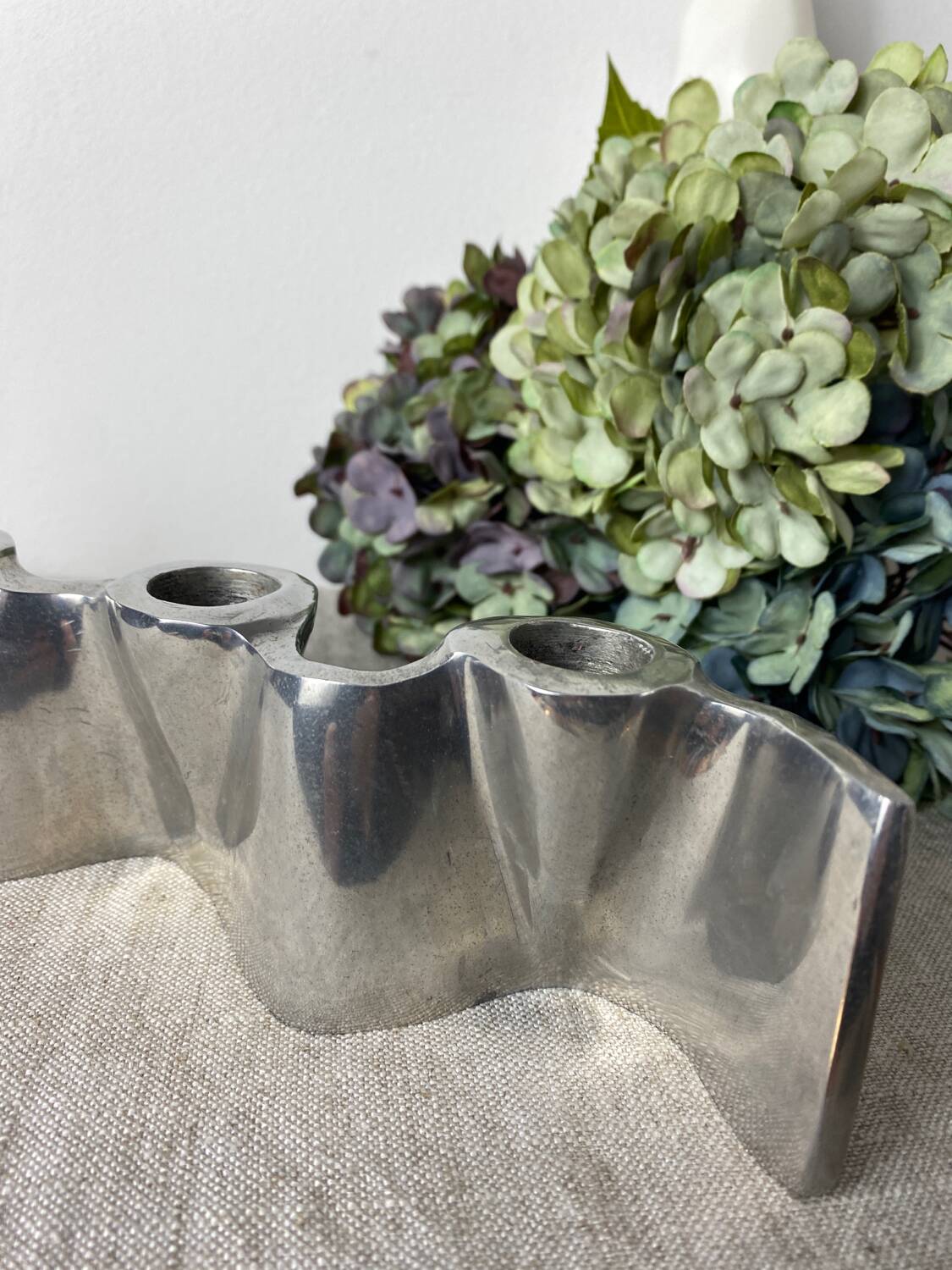 Brushed aluminum candle holder