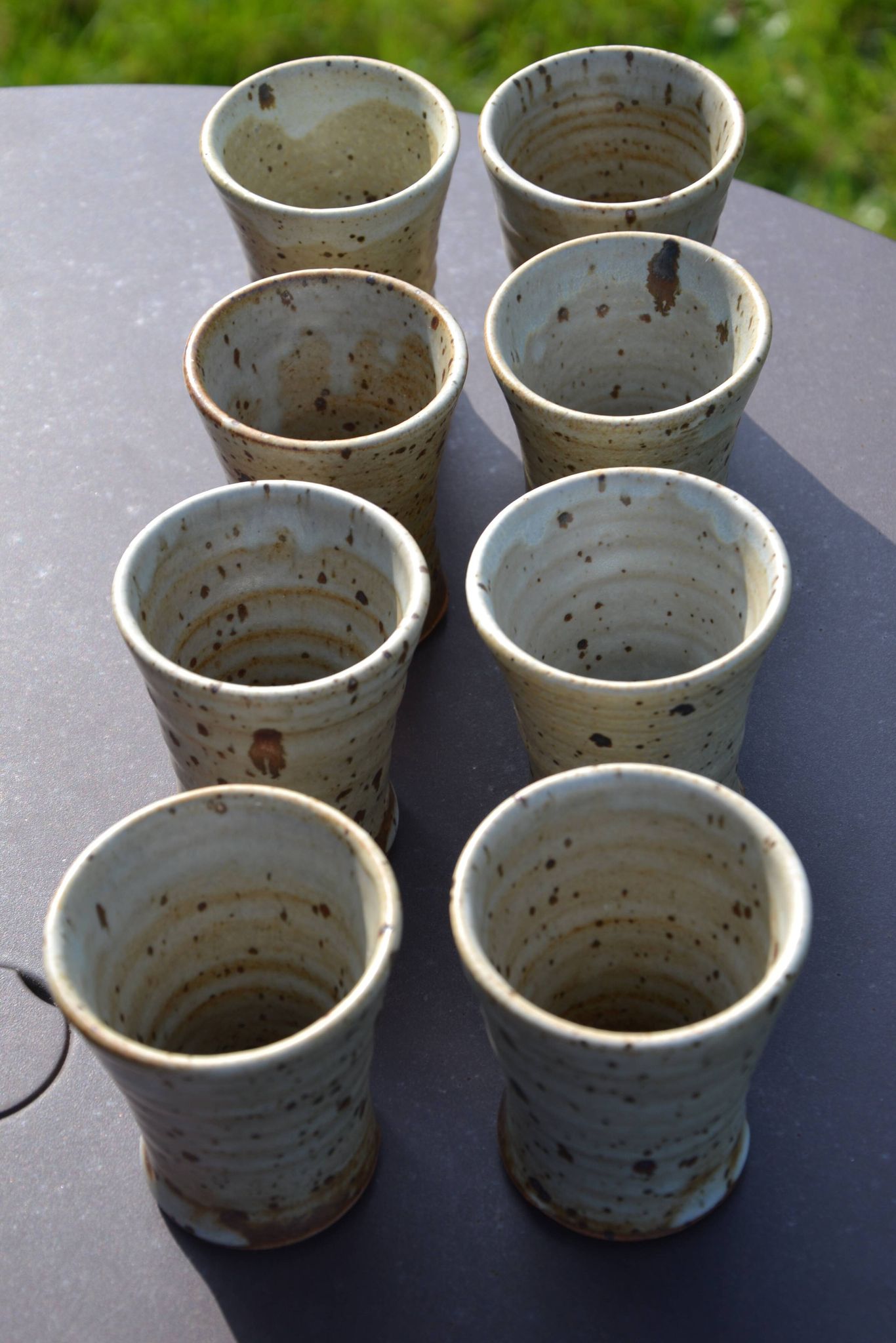 8 stoneware cups/mugs by Gustave Tiffoche