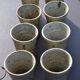 8 stoneware cups/mugs by Gustave Tiffoche