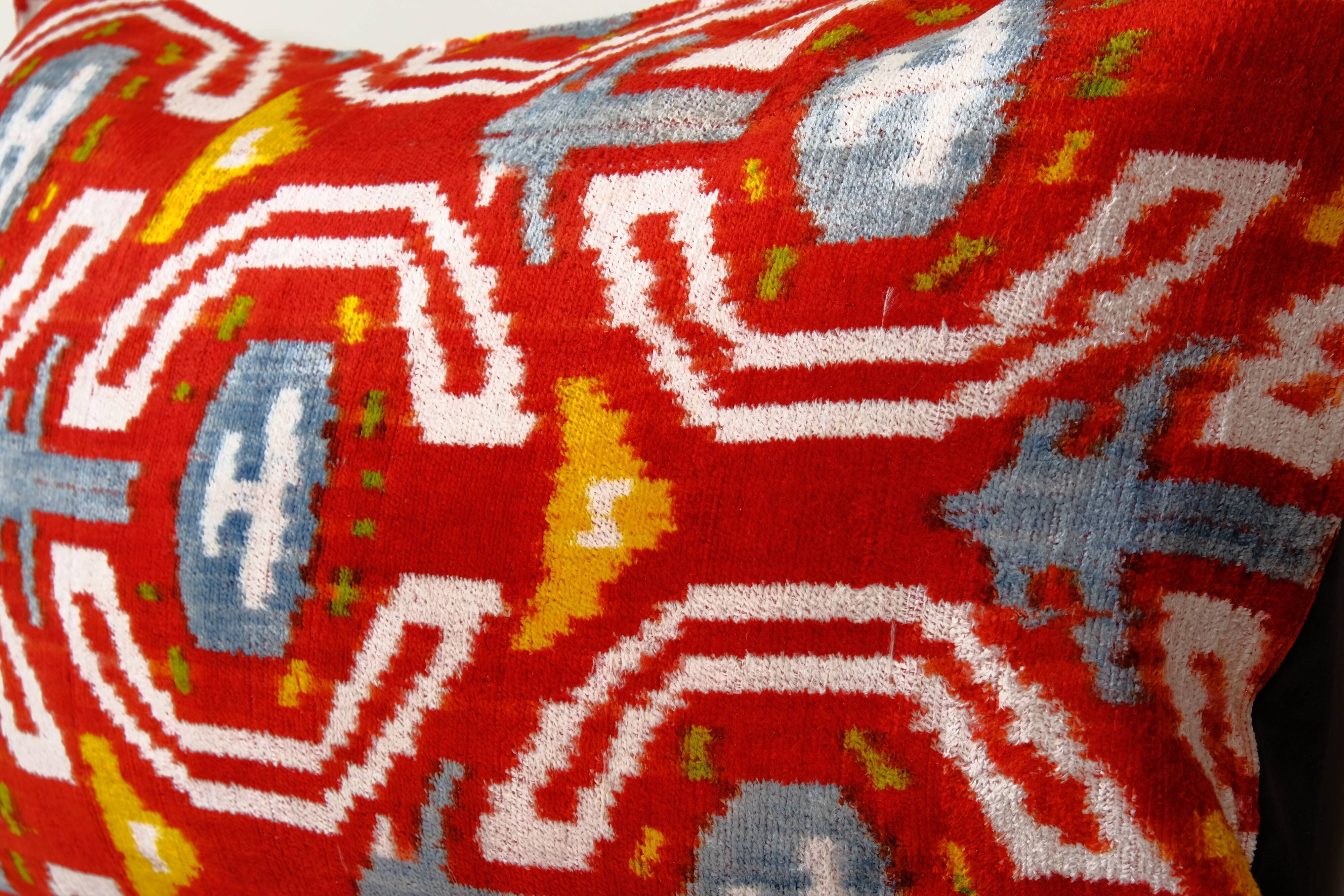 Set of two red ikat velvet lumbar pillows